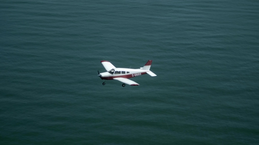 Single Engine Private Plane Flying over the Sea, Air to Air View. Royalty-Free Stock Footage #1096173231