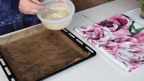 A man puts dough for multi-cereal loaves on a baking sheet. The camera moves on a slider. - Powered by Shutterstock - Get 15% off with code: PIKWIZARD15
