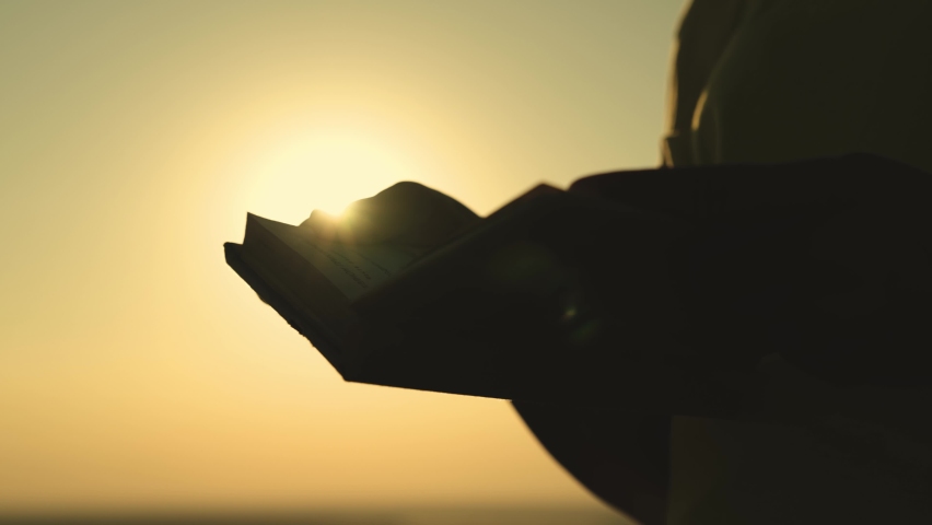 book hand praying girl sunset. sunlight female hands book. man dream. outdoor meditation. religious girl with bible her hands. ask heaven for peace kindness. worship bible scripture. spiritual work Royalty-Free Stock Footage #1096180235