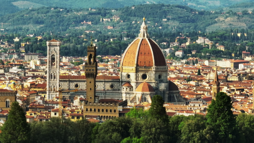 Florence Cathedral and towers in historic city centre. Parallax effect with row of trees in foreground. Florence, Italy Royalty-Free Stock Footage #1096196051