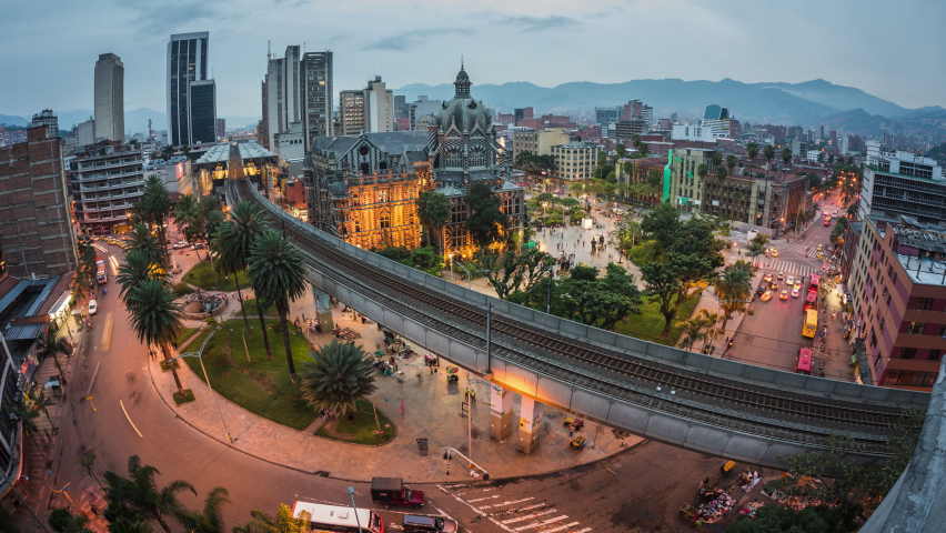 Dusk to night timelapse view of traffic around Plaza Botero square in Downtown Medellin, Antioquia Department, Colombia, zoom in.