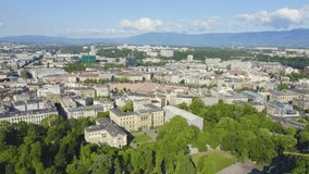 Inscription on video. Geneva, Switzerland. Flight over the central part of the city. Plen de Plenpale Square. Arises from blue water, Aerial View