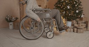 Senior disabled man in a decorated Christmas house