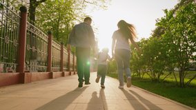 happy family. mother father child run through park sunset. mom dad kid fun running sun. view from back. happy family park. chidhood dream. family walk with kid around city playing. run teamwork - Powered by Shutterstock - Get 15% off with code: PIKWIZARD15