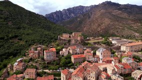 Corsica travel and landmarks. aerial drone video of medieval Corte town- mountain village in the middle of island
