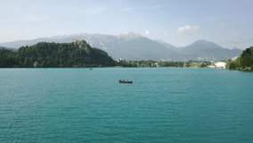 lake bled drone aerial Pilgrimage Church of the Assumption of Mary In . Bled Island In Slovenia With 
 bled Castle Museum On Precipice And Rocky Mountain 4k Footage raw summer  Virgin Mary 