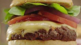 cheeseburger being smashed with dripping ketchup in slow motion and zoom in - Powered by Shutterstock - Get 15% off with code: PIKWIZARD15