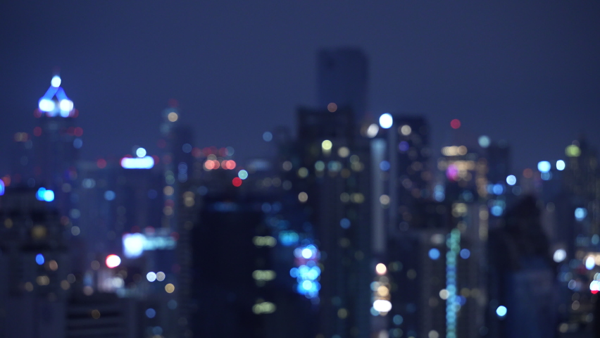 Blur view of the night city light Bokeh with skyscrapers out of focus lights. horizontal 4k height resolutions 2160 x 3840 | Shutterstock HD Video #1096216437