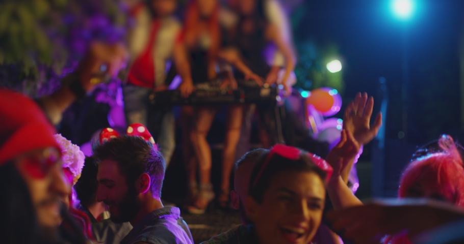 Footage of a crowd or group of young, stylish multi-ethnic people during colorful party in different clothes . Dancers having fun dancing at a party . Shot on RED HELIUM Cinema Camera in slow motion . Royalty-Free Stock Footage #1096218333