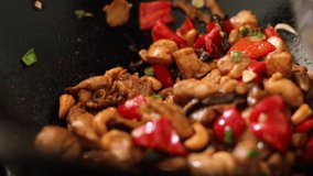 Cooking a savory chicken and vegetable stir fry in a wok - Powered by Shutterstock - Get 15% off with code: PIKWIZARD15
