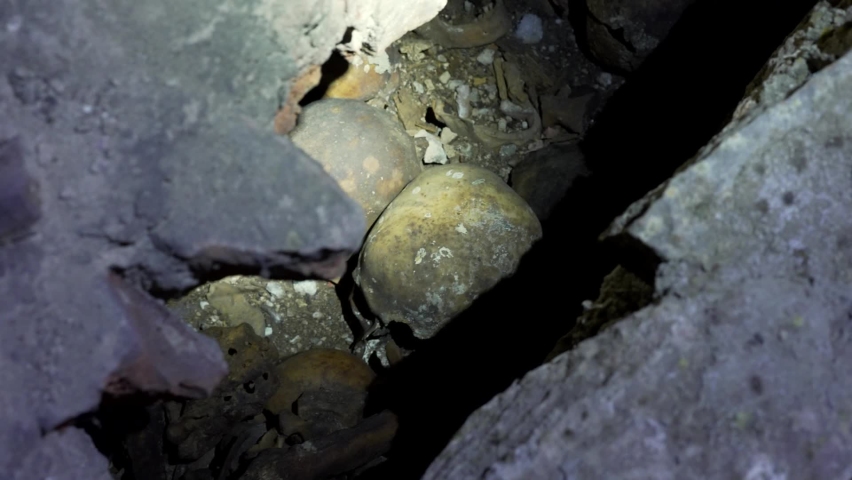 Human remains, bones and skulls in the old monastery crypt Royalty-Free Stock Footage #1096226333