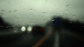 The highway in the rain, the view from the car's cockpit, the wipers collect water from the windshield. - Powered by Shutterstock - Get 15% off with code: PIKWIZARD15