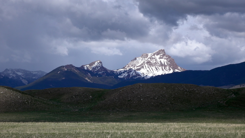 Beautiful View Of Snow On Rock Formations Against Cloudy Sky - Yellowstone Park, Montana