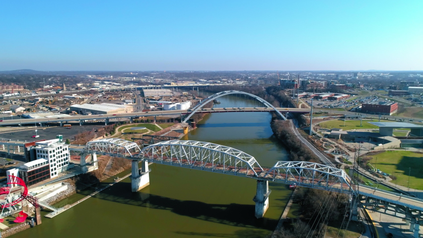 Aerial Shot Of Famous Bridges Over River In City, Drone Flying Forward On Sunny Day - Nashville, Tennessee