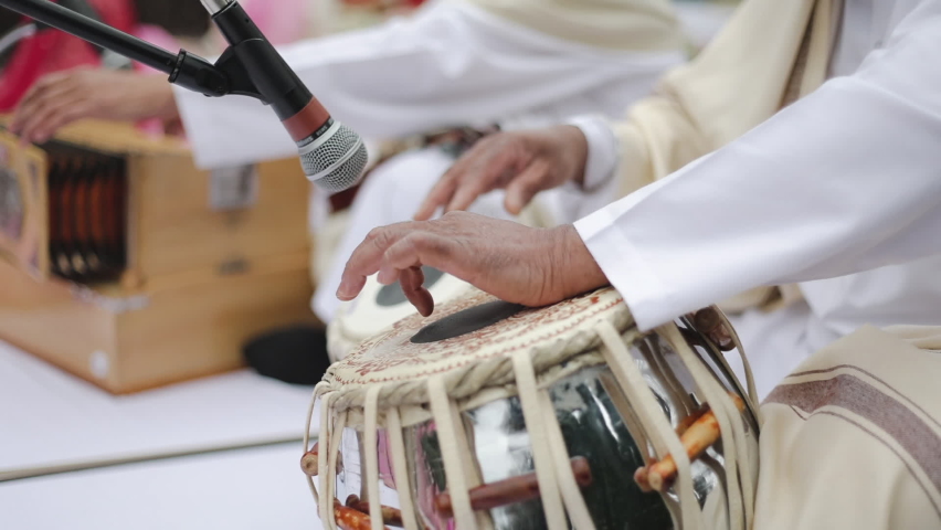 Man Playing Traditional Indian Classical Musical Instrument Tabla. Indian twin hand drums Royalty-Free Stock Footage #1096234395
