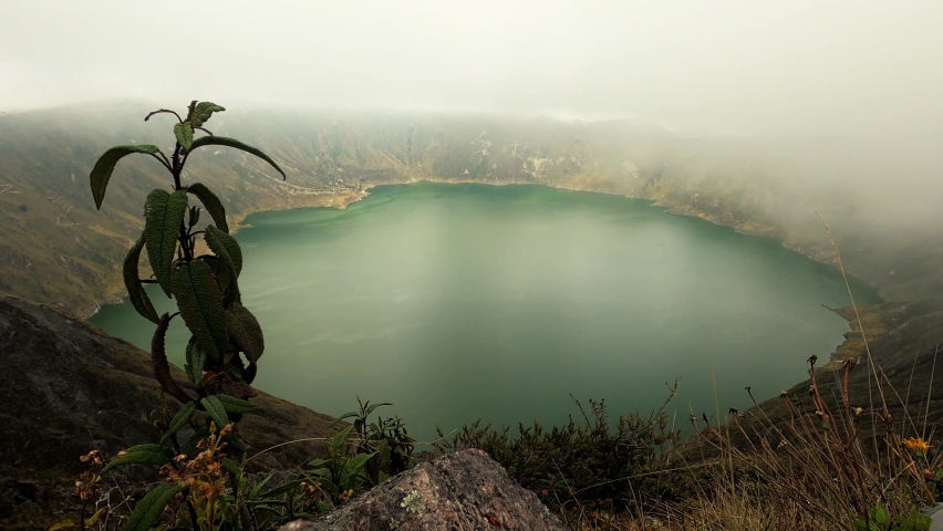 Timelapse of low clouds moving across Quilotoa lake in Ecuador, Andes Mountains. 