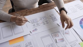 Website designer, Creative planning phone app development template layout framework wireframe design, User experience concept, Young asian woman UX designer working on smartphone application at office - Powered by Shutterstock - Get 15% off with code: PIKWIZARD15