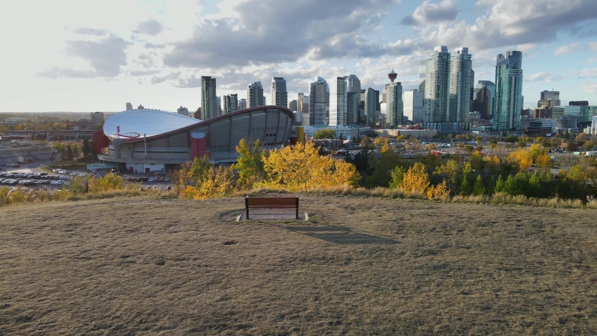 Calgary, Alberta, Canada - September 28, 2021: City center Arial drone view. Skyscrapers of business downtown and Olympic Saddledome hockey stadium.