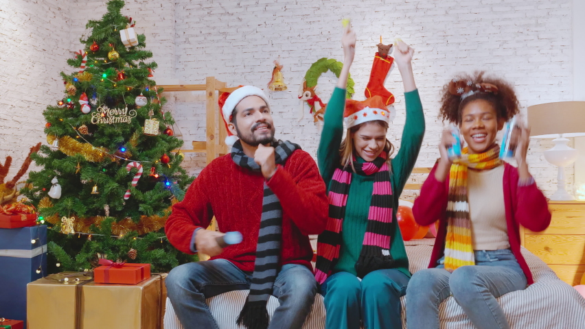Group of happy young friends countdown and celebrate in Christmas eve and happy new year with excited and fun together at home, congratulation and party annual in festive xmas holiday and seasonal.