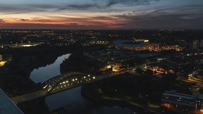 Establishing Aerial View Shot of Sunderland UK, Tyne and Wear, United Kingdom, track in, wide, superb sunset, night evening