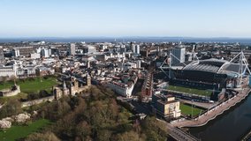 Establishing Aerial View Shot of Cardiff UK, capital of Wales, United Kingdom, wide view of the city, pull back