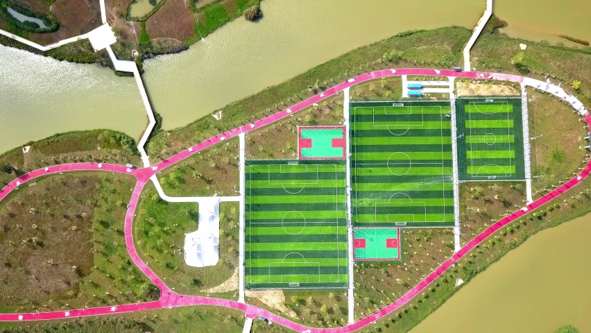 Aerial Footage of the new football field on the island in the middle of the lake