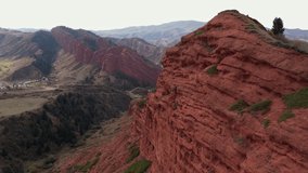 Aerial view of rock formation Djety-Oguz at sunset. Drone Video of Seven Bulls Rock Formation, Karakol, Kyrgyzstan, Nature's, Landscape, Issyk Kul Lake, Kyrgyzstan, Central Asia, 4K.