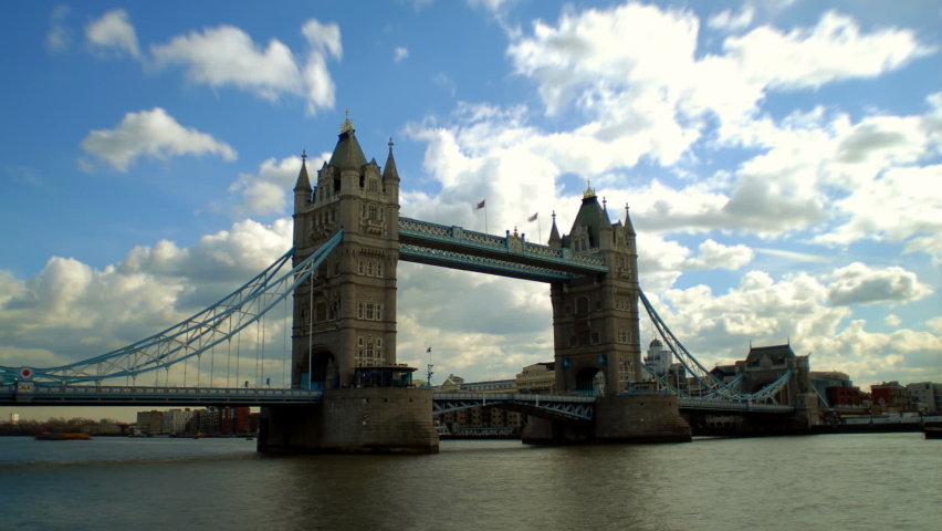 London bridge in England with river fast moving clouds in the evening 