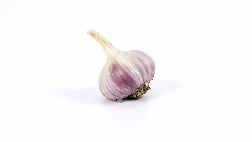 Spining garlic on the white background, garlic on the white , close-up of garlic, garlic rotating on a white background | Shutterstock HD Video #1096262989