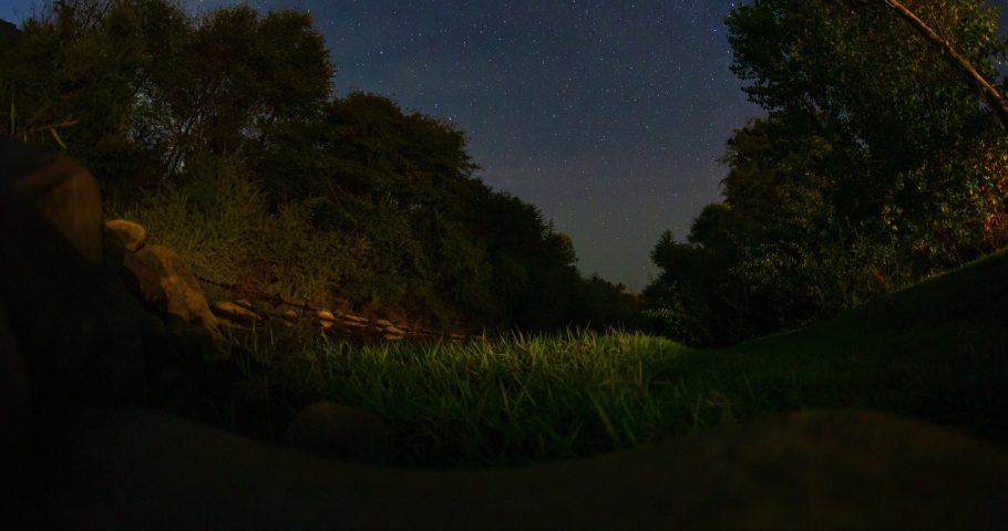 Polaris Star Trails Over River Valley Night Timelapse