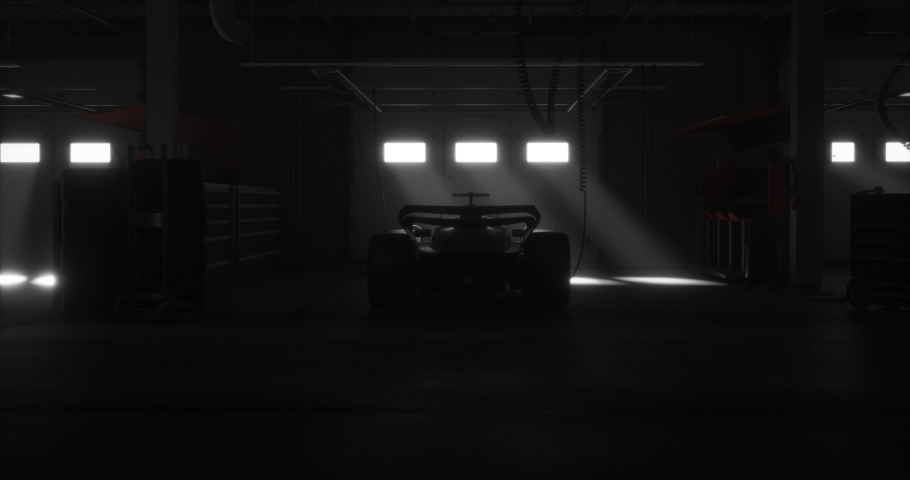 DOLLY IN Back view silhouette of a modern generic sports racing car standing in a dark garage on a pit lane, cinematic lighting. Realistic 3d rendering Royalty-Free Stock Footage #1096271073
