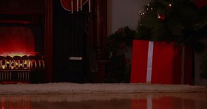 Animation of merry christmas text over christmas presents and fireplace. christmas, tradition and celebration concept digitally generated video.