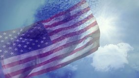 Animation of waving flag of usa over cloudy sky. travel, holidays, patriotism and celebration concept digitally generated video.