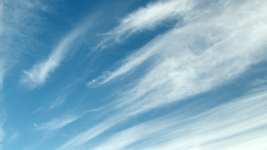 Timelapse of cirrus clouds passing by on a sunny day Royalty-Free Stock Footage #1096295975