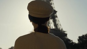 Portrait of a girl looking at the Eiffel Tower