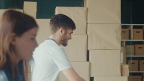 The Concept of Social Aid: A Child in a Volunteer Center Receives a Box of Food from Friendly Volunteer at at Distribution or Refugee Assistance Center. - Powered by Shutterstock - Get 15% off with code: PIKWIZARD15