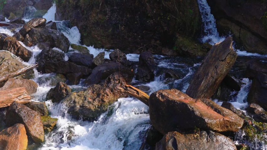 Niagara Falls from the American and Canadian sides. Rainbow over the waterfall. The most popular tourist place. Stormy river that flows into the lake.