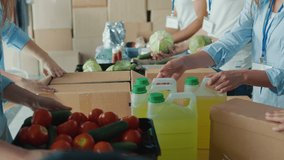 Close-up. Hands of Volunteers Sorting Humanitarian Aid at Distribution or Refugee Assistance Center. The Concept of Social Aid. Internally Displaced Persons. Charity Project or Donating Aid - Powered by Shutterstock - Get 15% off with code: PIKWIZARD15