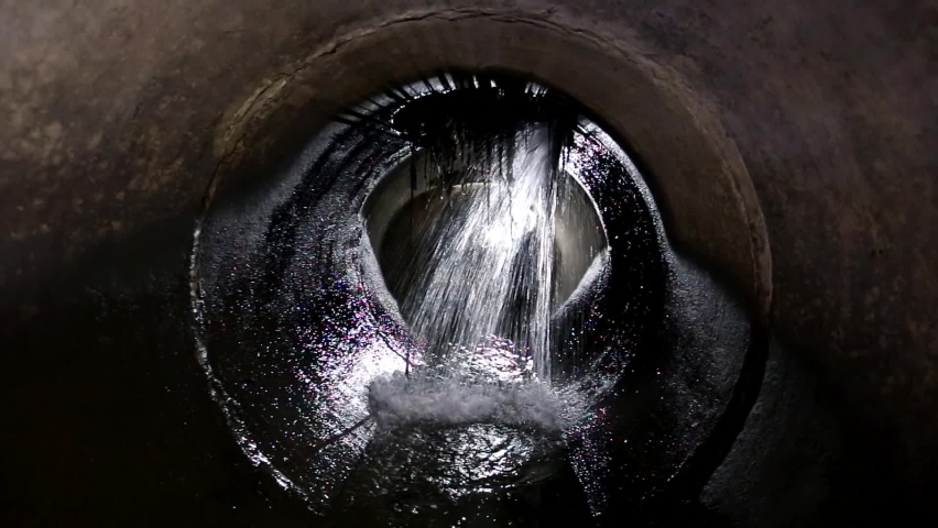 Leak of water into round sewer tunnel Royalty-Free Stock Footage #1096315771