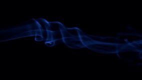 Smoke isolated on black background. Blue smoke raising up over black. Steaming cup of hot tea or coffee, food or drink. Slow motion video