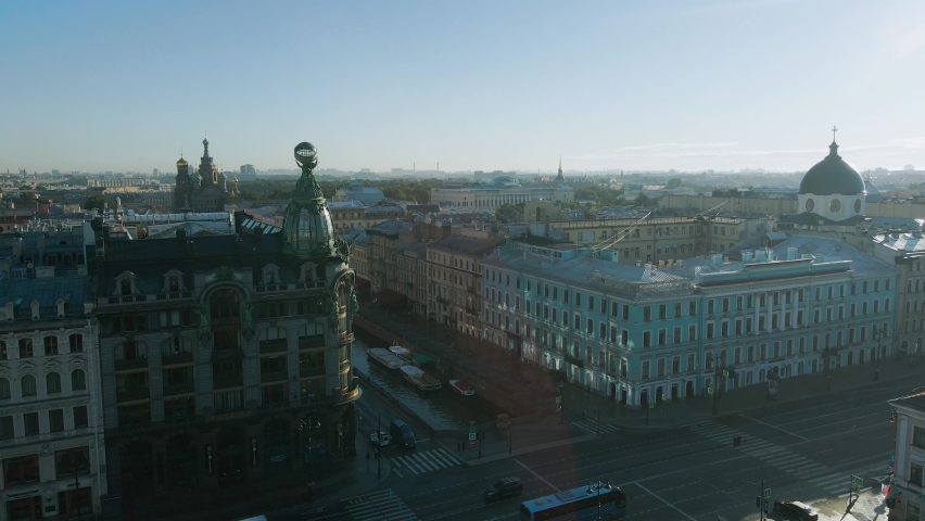 Aerial view of the Nevski street and Cathedral of the Resurrection of Christ next to House of the Singer company in the historical and at same time modern city of St. Petersburg at sunny summer day	
