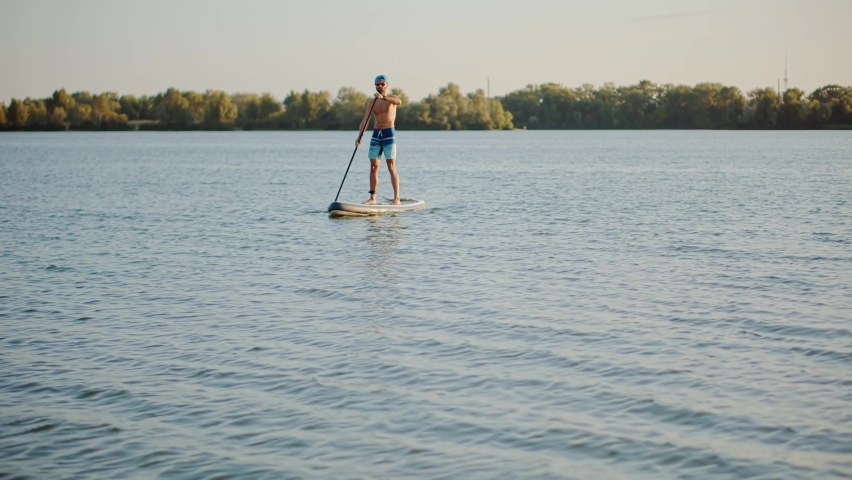 Sup Stand Up Paddle Boarding Fitness. Warm Summer Beach Vacation. Travel Paddles Paddleboard. Sup Board Journey. Paddleboarder On Sup Surf Swimming. Watersport Floating Surfboard Sport Recreation Royalty-Free Stock Footage #1096326001