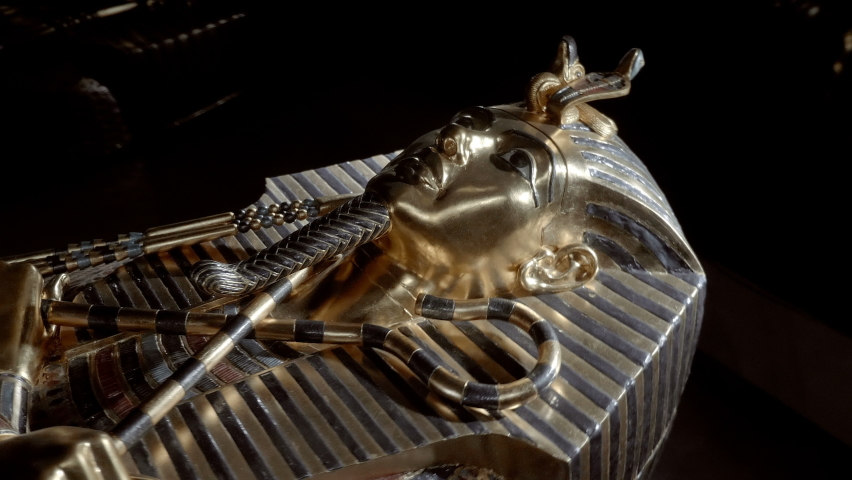 Tutankhamen - pharaoh of ancient Egypt from the XVIII dynasty of the New Kingdom. Tutankhamen's inner sarcophagus - one of the exhibits of Tutankhamun's tomb, a symbol of Ancient Egypt. Shot in motion Royalty-Free Stock Footage #1096328655
