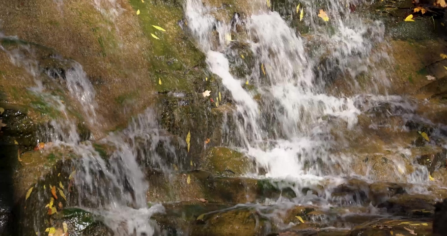 Autumn video of a scenic waterfall located in Lansing NY, Emilie Jonas Nature Falls Trail, near Ithaca, New York.