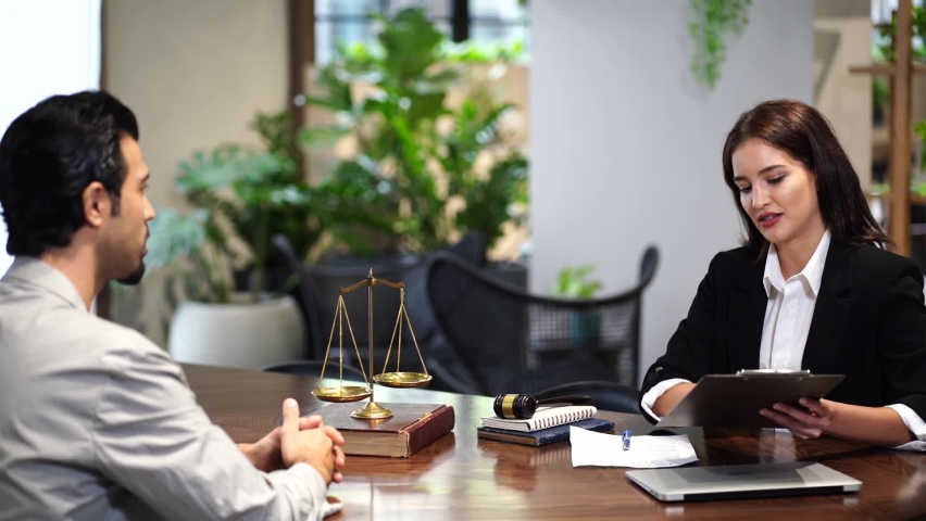lawyer talks and gives advice to the male client to consult the law at the lawyer office Royalty-Free Stock Footage #1096342047
