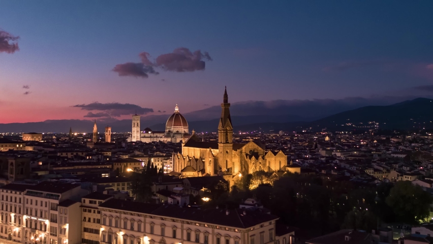 Aerial panoramic view of Florence Cathedral, Firenze Cattedrale di Santa Maria del Fiore, Ponte Vecchio and Arno River on a beautiful colourful sunset sky, Tuscany region of Italy Florence Royalty-Free Stock Footage #1096342185
