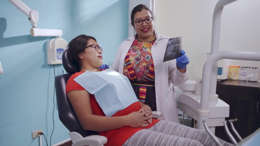 Indigenous dentist with a patient in the clinic. Royalty-Free Stock Footage #1096347515