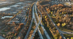 Afternoon aerial, drone, video of NY Route 17 just west of the diverging diamond interchange (DDI), located in Woodbury, NY, with a dolly move pulling away from subject.	