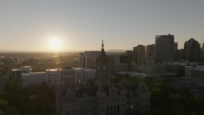 clock tower sunset behind the clock Tower behind the sunset thigh building Italy style building church Salt Lake City Utah Downtown building Golden hour Mountain gardensa clear sky