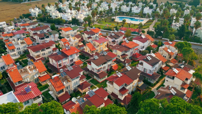 ascending view of hotels, pools and houses surrounded with trees, Okurcalar, Turkey. High quality 4k footage